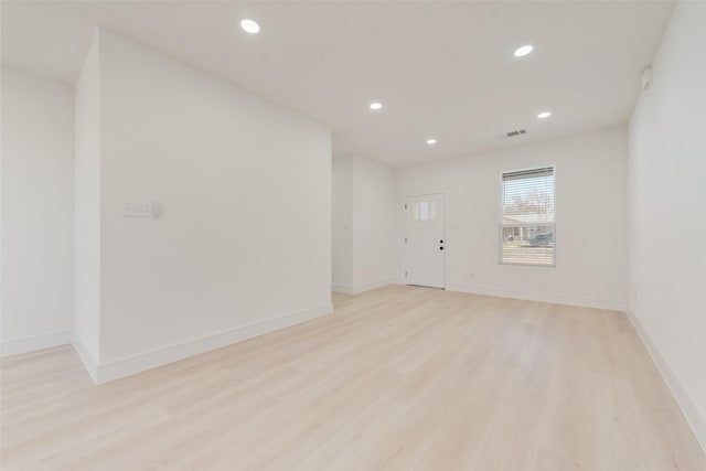 unfurnished room featuring light hardwood / wood-style flooring