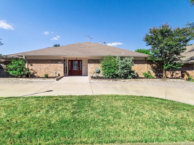 ranch-style house with a front lawn