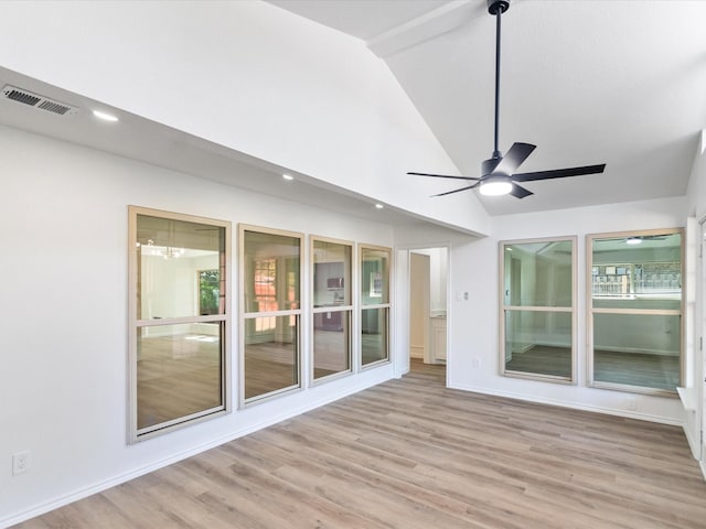 interior space with ceiling fan, light wood-type flooring, and lofted ceiling