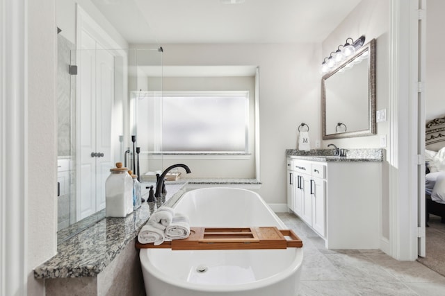 bathroom featuring a wealth of natural light, vanity, and shower with separate bathtub