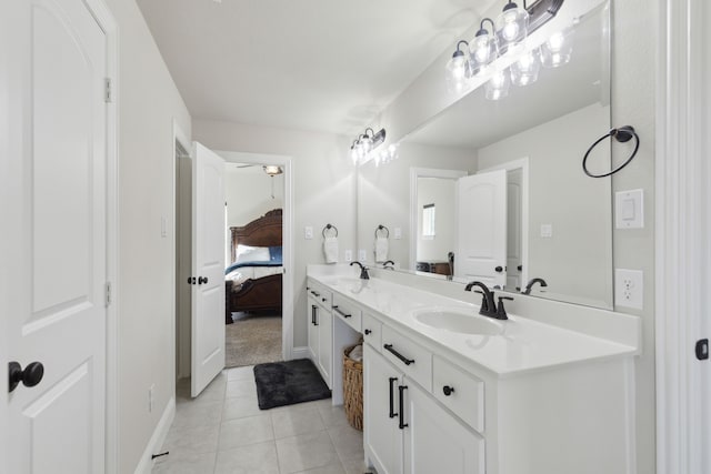 bathroom featuring tile patterned flooring and vanity