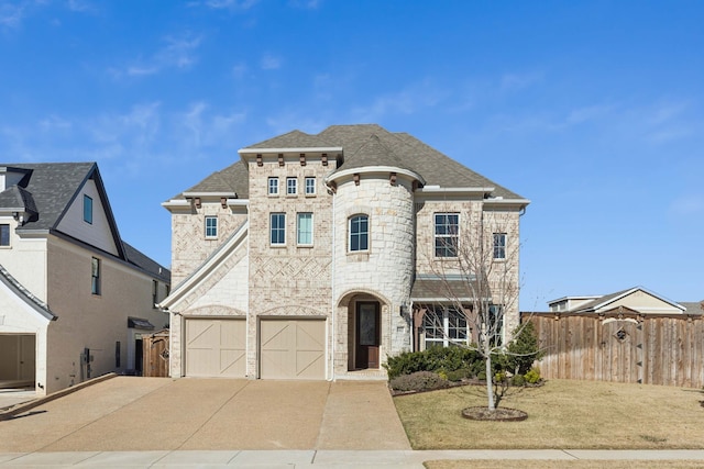 view of front of property featuring a front lawn and a garage