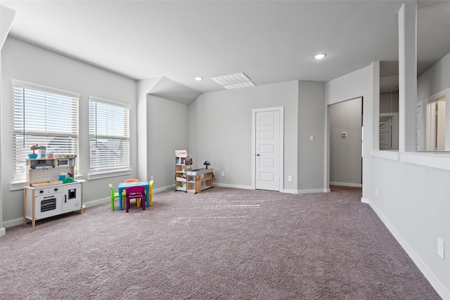 rec room featuring carpet flooring and vaulted ceiling