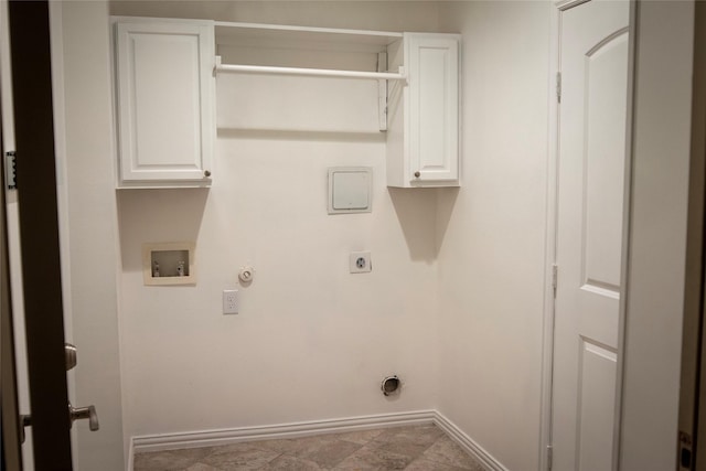 washroom with cabinets, electric dryer hookup, hookup for a gas dryer, and hookup for a washing machine