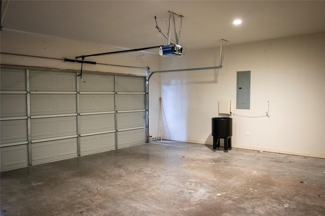 garage featuring electric panel and a garage door opener