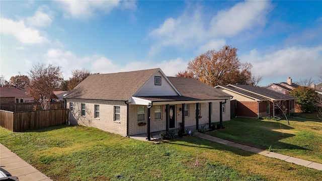 back of house with a lawn