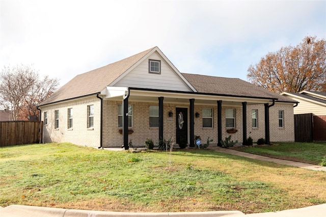 view of front of home featuring a porch and a front yard