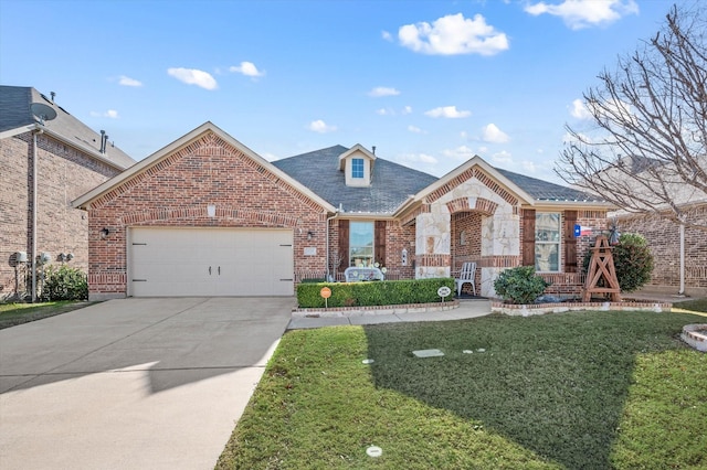 view of front of property featuring a garage and a front lawn