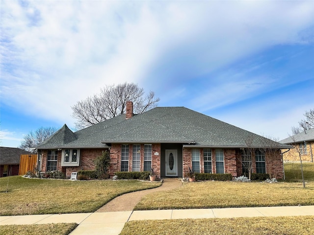 ranch-style home featuring a front lawn