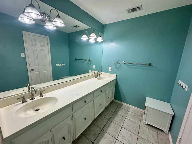 bathroom with tile patterned floors and vanity