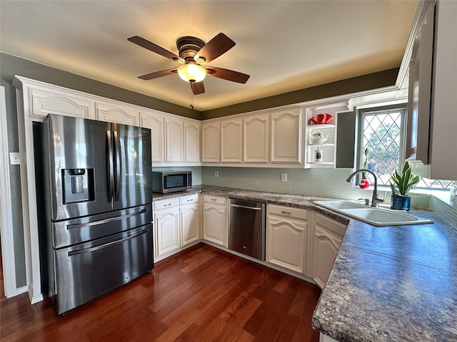 kitchen featuring sink, dark hardwood / wood-style floors, ceiling fan, white cabinetry, and stainless steel appliances