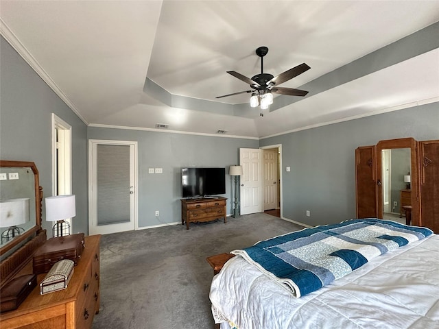 carpeted bedroom featuring ceiling fan, a raised ceiling, and crown molding