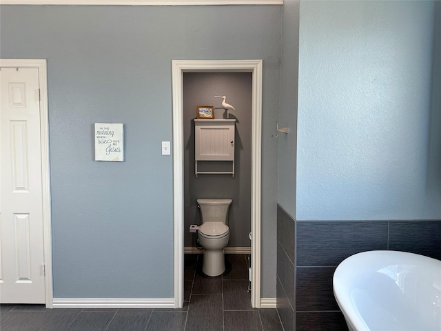 bathroom with a bathtub and toilet