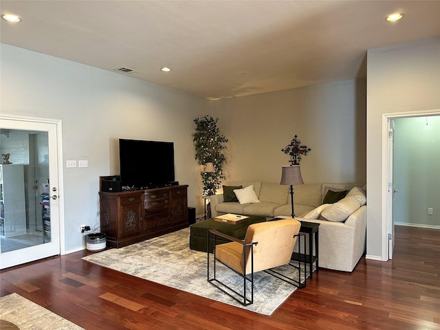 living room with dark hardwood / wood-style floors