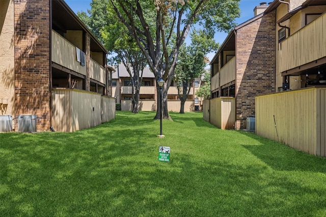 view of yard with central AC unit