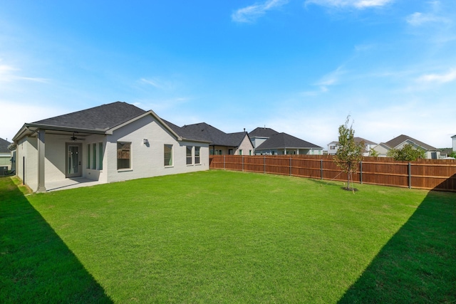 view of yard with ceiling fan