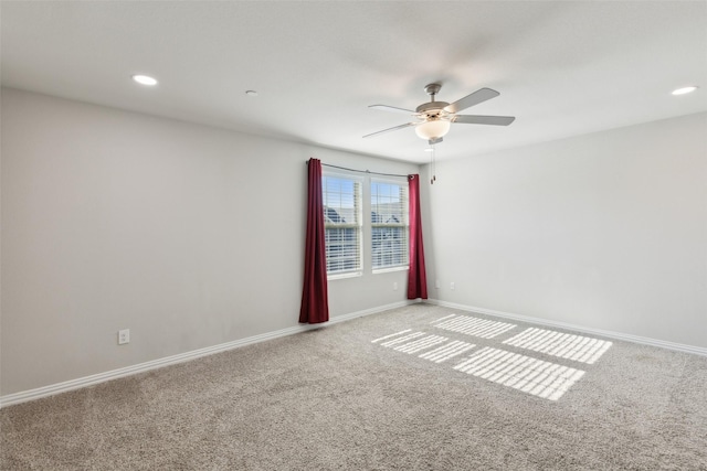 unfurnished room with carpet and ceiling fan