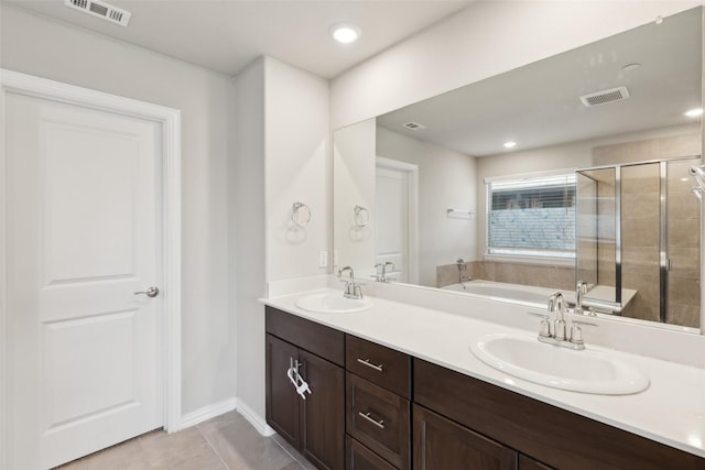 bathroom with vanity, tile patterned floors, and independent shower and bath