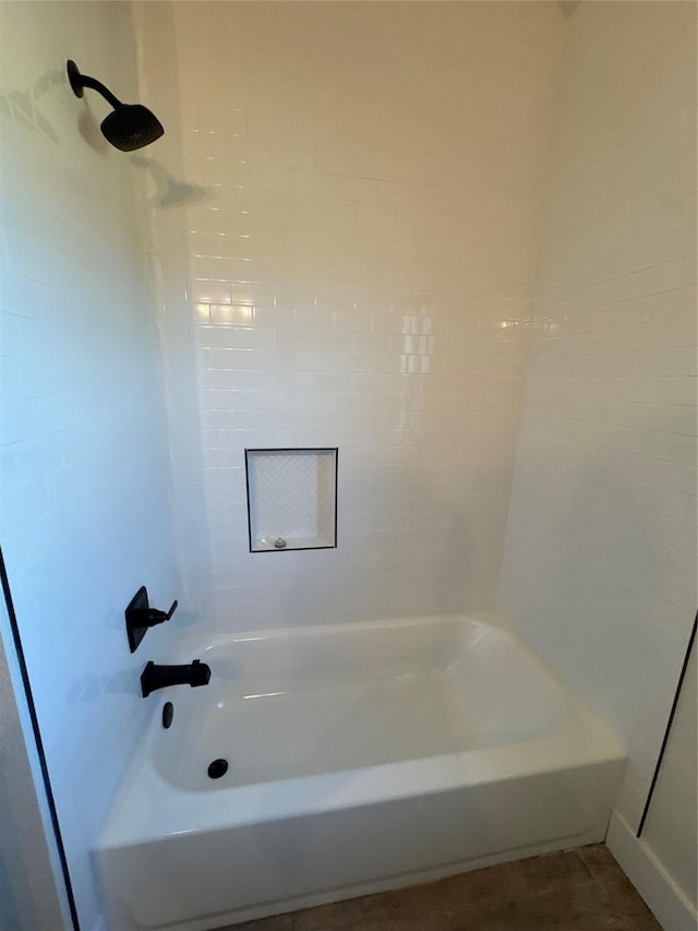 bathroom with washtub / shower combination