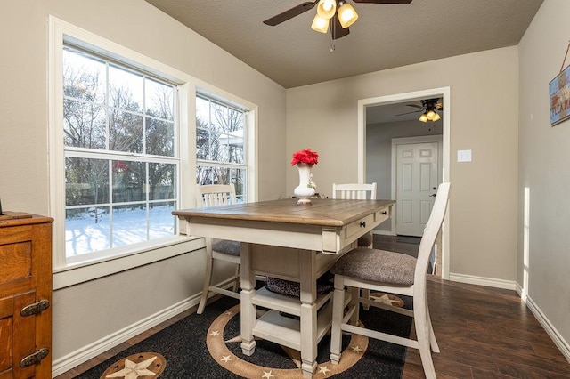 dining space with dark hardwood / wood-style floors and ceiling fan