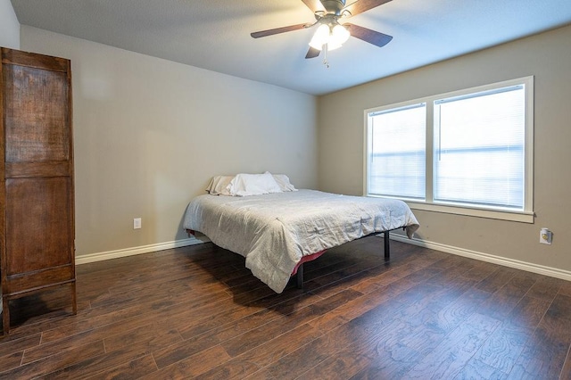 bedroom featuring ceiling fan and dark wood-type flooring