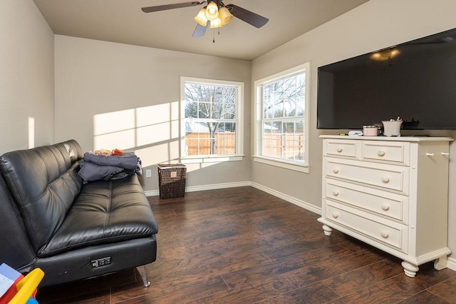 living room featuring dark hardwood / wood-style floors and ceiling fan