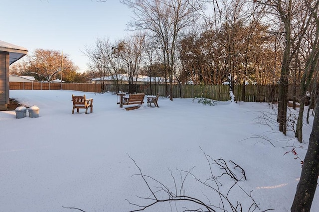 view of yard layered in snow