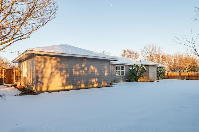 view of snow covered property