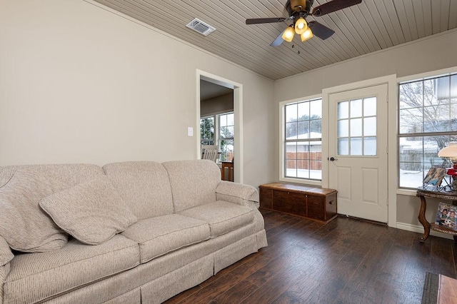 living room featuring crown molding, ceiling fan, dark hardwood / wood-style flooring, and wooden ceiling