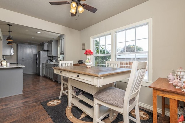 dining room featuring dark hardwood / wood-style floors and ceiling fan