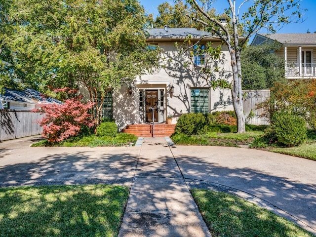 view of front of house with fence