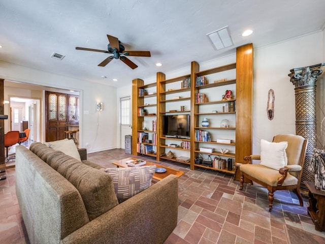 living area with recessed lighting, stone tile floors, a ceiling fan, baseboards, and visible vents