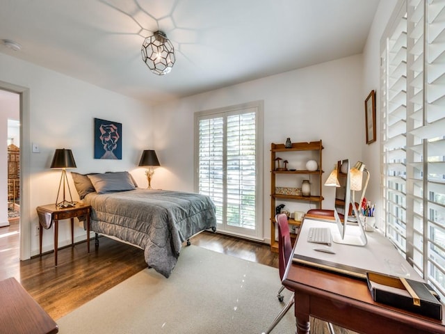 bedroom featuring wood finished floors