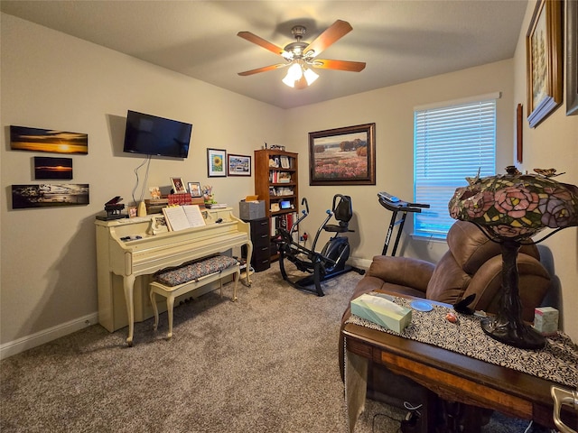 interior space with ceiling fan and carpet