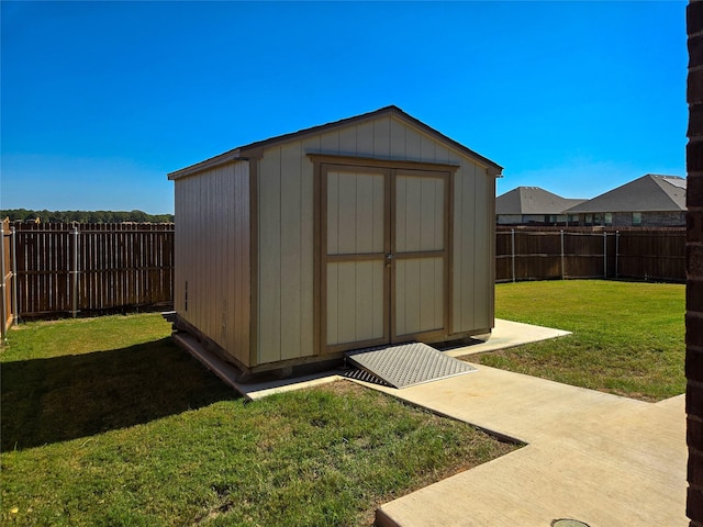 view of outbuilding featuring a yard