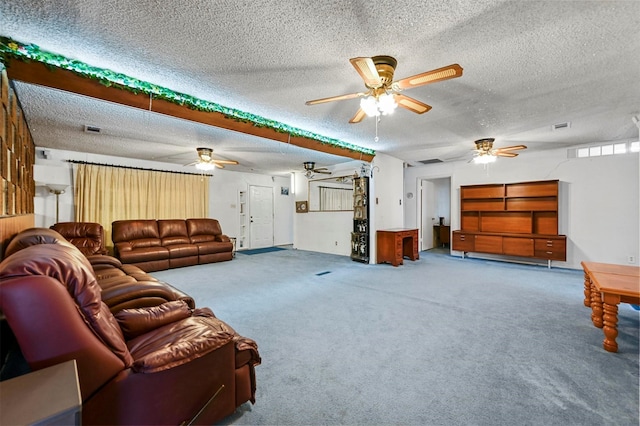 carpeted living room featuring a textured ceiling