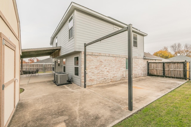 view of home's exterior featuring central air condition unit and a patio