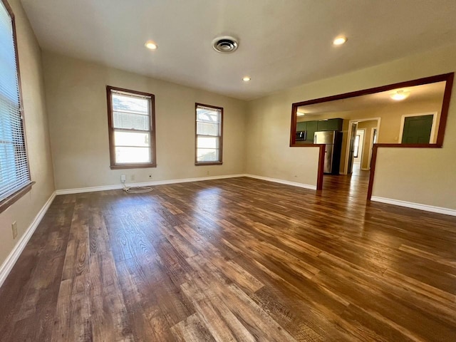 unfurnished room featuring dark hardwood / wood-style flooring