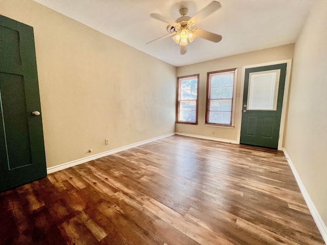 unfurnished room featuring hardwood / wood-style flooring and ceiling fan