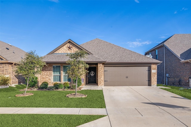 view of front of house featuring a garage and a front yard