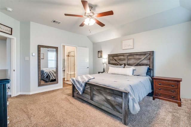 carpeted bedroom with connected bathroom, ceiling fan, and lofted ceiling