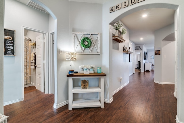 hallway featuring dark wood-type flooring