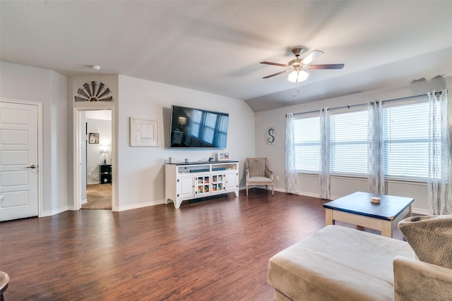 living room with ceiling fan and dark hardwood / wood-style flooring