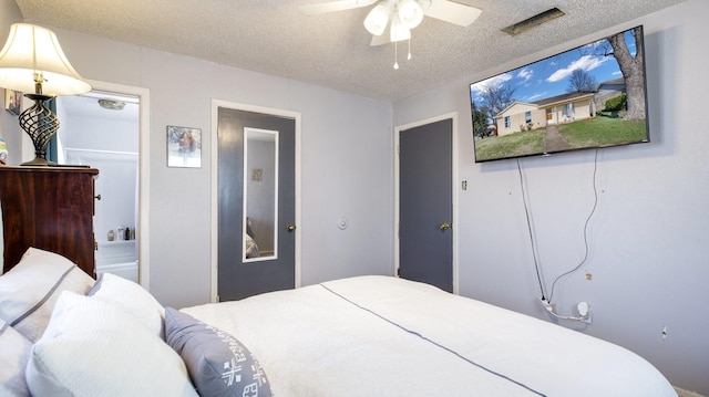 bedroom featuring a textured ceiling and ceiling fan