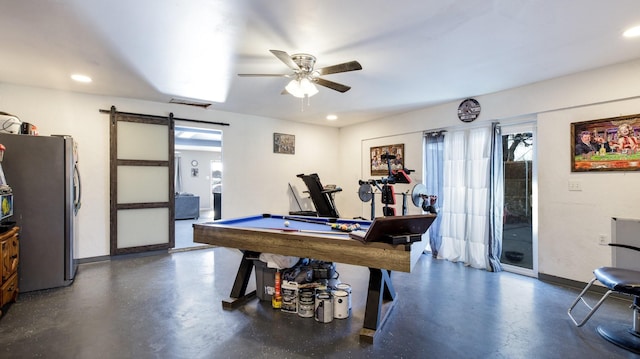 recreation room featuring ceiling fan, a barn door, and billiards