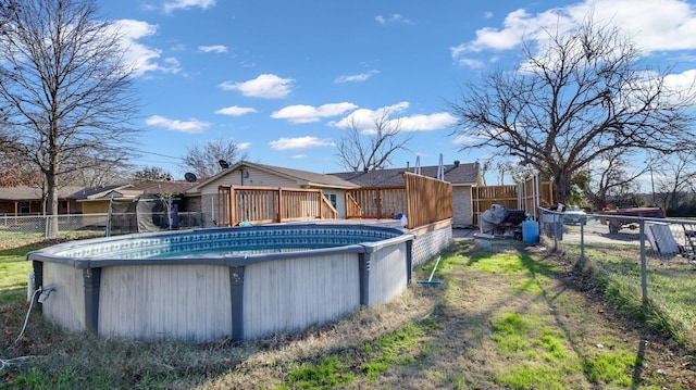 view of swimming pool with a deck