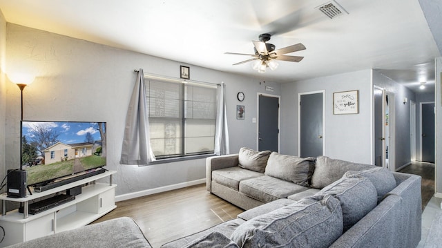 living room with ceiling fan and wood-type flooring