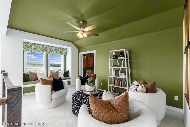 living room featuring carpet, vaulted ceiling, and ceiling fan