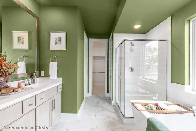 bathroom featuring vanity and an enclosed shower