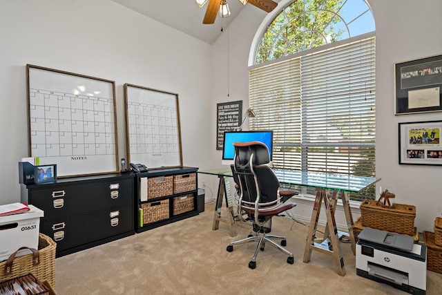 office space featuring carpet, high vaulted ceiling, and ceiling fan